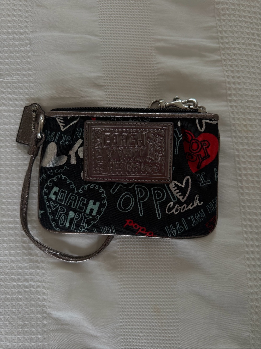Coach Poppy Black Graphic Heart Wristlet with Red & Teal Accents